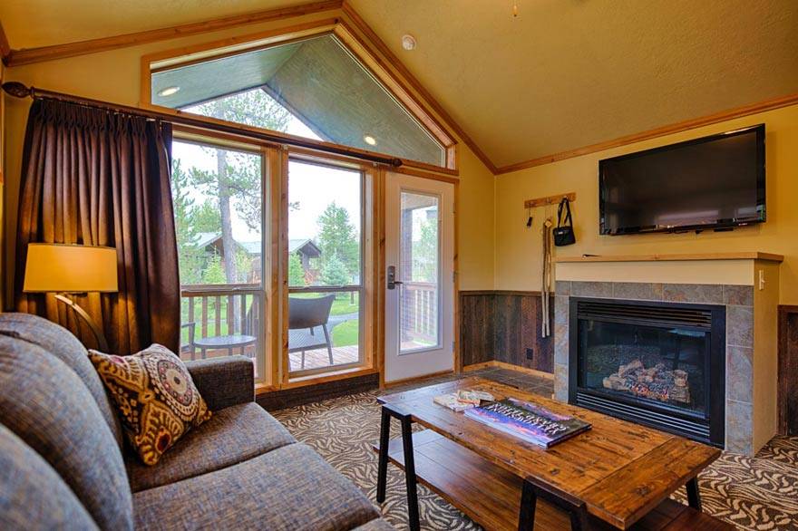 Unwind in front of a fireplace and flat screen TV in our Old Faithful cabins.