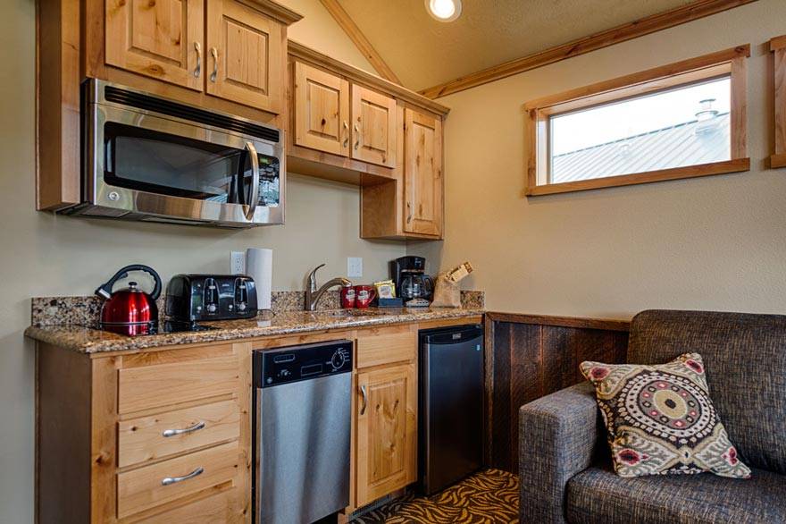 Kitchenettes in our Old Faithful cabins include a microwave, dishwasher, toaster, stove top, and much more!