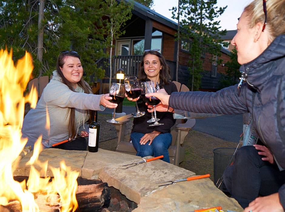 Explorer Cabins guests enjoying a glass of wine by our outdoor fire pits