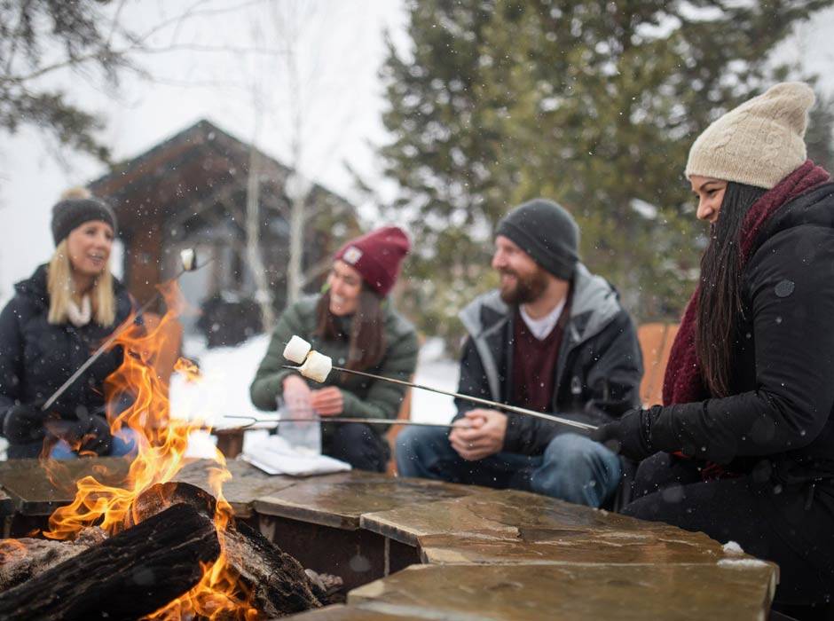 Explorer Cabins at Yellowstone guests roasting s'mores
