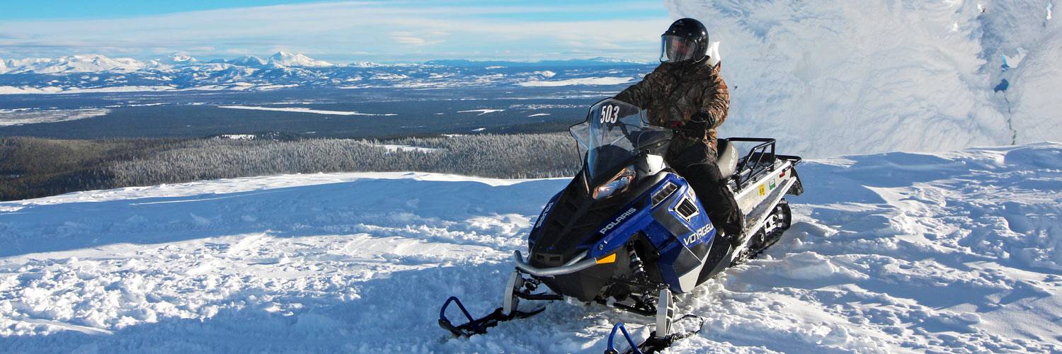 Snowmobiler in Yellowstone National Park during the winter