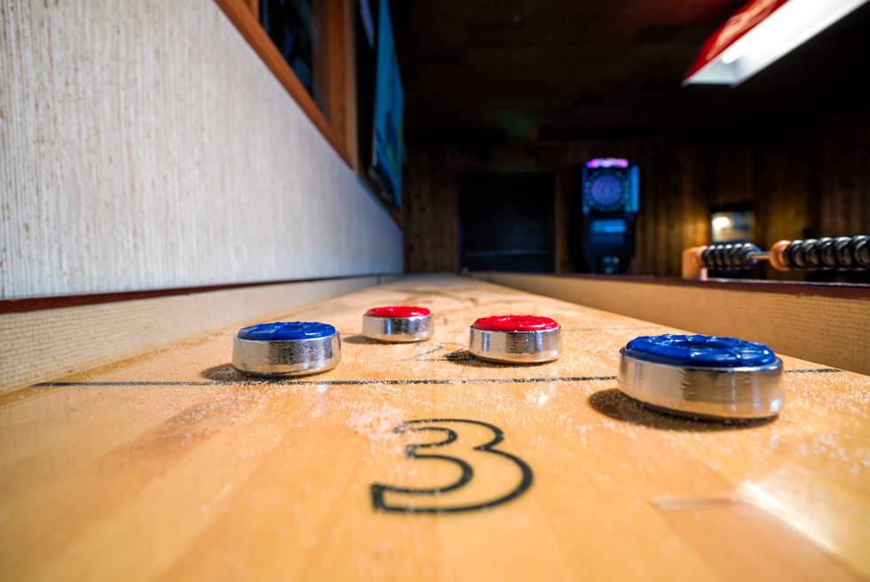 Enjoy a game of shuffleboard at The Yellowstone Mine Restaurant in Gardiner, MT