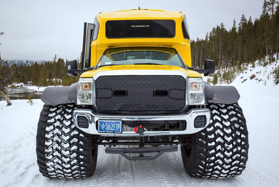 Our fleet of snowcoaches features oversize tires to easily drive over the snow.