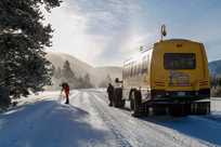 A photographer shooting the landscape on a Yellowstone Snowcoach Tour