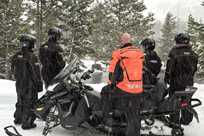 This Yellowstone snowmobiling group takes a stop to witness a rare sight...