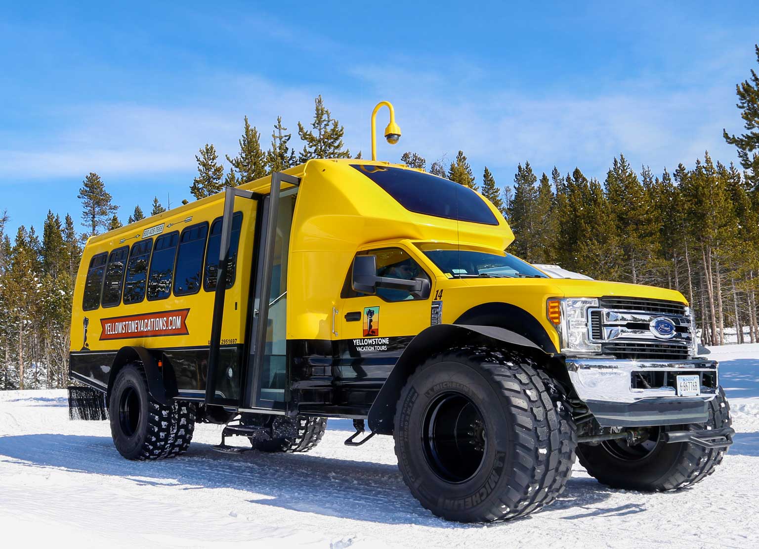 A Yellowstone Vacations snowcoach in winter