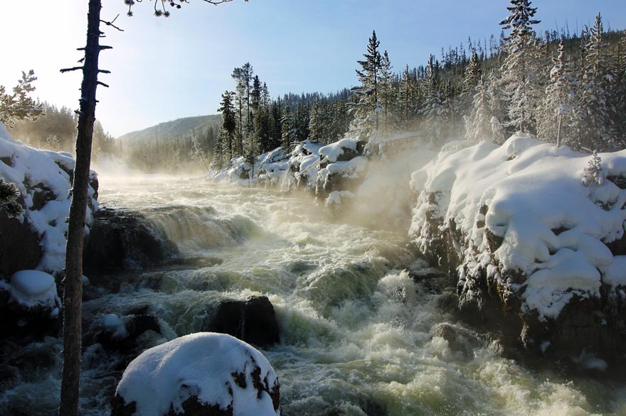 A rushing river in Yellowstone National Park during winter